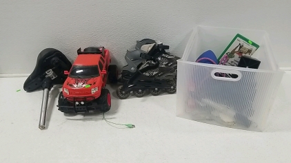 RC Truck, Bike Seat w/ Bar, Size 5-8 Roller Blades, Box of Mixed items