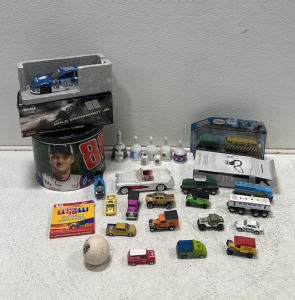 Dale Earnhardt Jr. Die Cast Nascar, Dale Earnhardt Jr. Tin, BackBeat Fit Earbuds, (11) Various Matchbox Cars, (1) Model Corvette, (4) Kids Train Toys, Thomas and Friends Diesel 10 Toy, (7) Ceramic Bells
