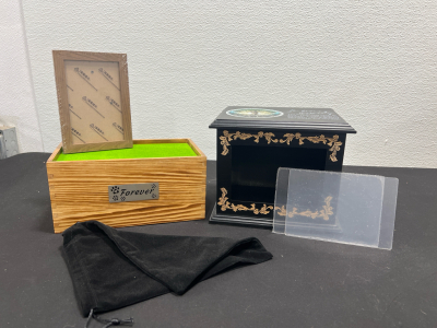 (1) Pet Urn- Wooden, With Picture Frame and Black Velvet Bag- Brand New (1) In Loving Memory Urn- Black Wood- Brand New- Good Condition