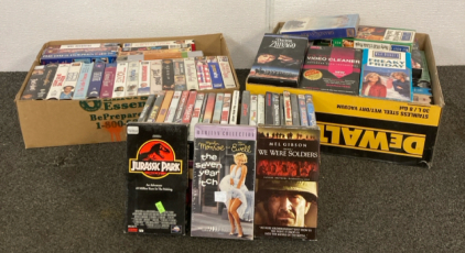 Collection of VHS and DVD Movies including Jurassic Park, We Were Soldiers, The Seven Year Itch, and Much More