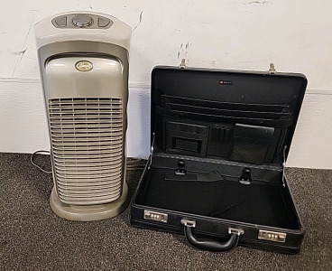 Hunter Fan CO. Upright Ion Generator Air Purifier.. and a Foray briefcase..