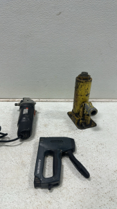 Black & Decker Angle Grinder, Yellow Hydraulic Bottle Jack, Stanley Aircraft Aluminum Staple Gun
