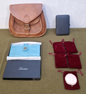 (1) Leather Satchel, (1) Pocket Book, (5) Pocket Mirrors & (1) Manicure Kit