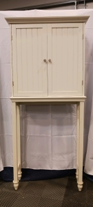 (1) Cream Wooden Cabinet on Tall Legs - 2 Doors w/ 2 Adjustable Shelves - 29⅛"x18&frac14;"x63"