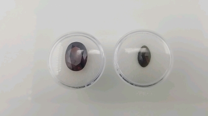(1) 11.10 ct Pigeon Blood Red Ruby, (1) .90 ct Natural Black Opal Gemstones