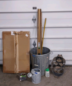 (1) Trash Can w/ (5) Assorted Yard Tools, (1) Metal Frog Lilly Pad Water Fountain Piece, Metal Watering Can, (1) 6"x 5"x 4" Box of Nails, & More!