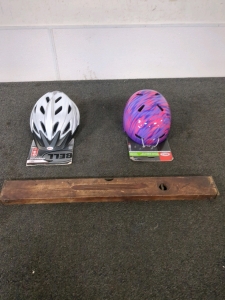 Old wooden level and bike helmets