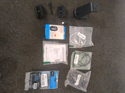 Assorted wires and phone charging stands