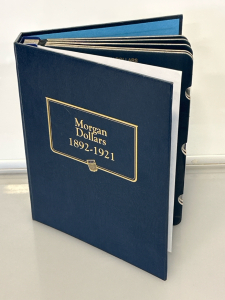 10 Morgan Silver Dollars with Collectors Book