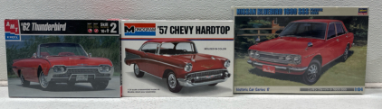 (1) Revell Classics Jaguar XK-120 Plastic Buildable Model Car, (1) Tamiya Jaguar Mk.II Racing Plastic Buildable Model Car, (1) Hasegawa 1969 Nissan Bluebird 1600 SSS Plastic Buildable Car Model