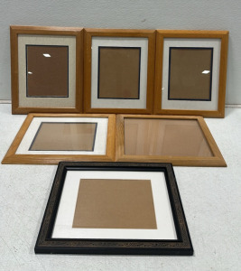 (4) Wooden Frames w/ White Inserts, (1) Wooden Frame, (1) Black Ornate Frame w/ White Insert