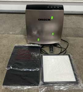 (1) Oreck Air Purifier w/ Remote (1)Filter Replacement Kit -Powers On & Functional Model # -WK10054