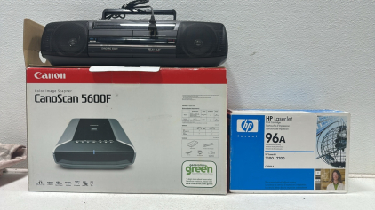 (1) Canon CanoScan 5600F Color Image Scanner, (1) HP LaserJet 96A Printer Cartdrige, (1) Panasonic Stereo Radio Cassette Recorder