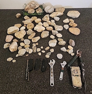Various Size Rocks With Quartz Veins... 3 Pocket Knives 2 Small Crescent Wrenches.. and a JLR Gear Multi Garden Tool..