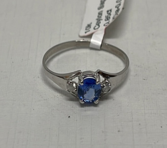 0.85ct. Oval Cut And Faceted Sapphire And 0.04ct. Diamond 10k White Gold Ladies Ring Size 6 (Estimated Value $2,500)