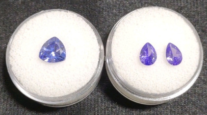 (1) 3.40ct. Natural Blue Tanzanite Faceted 8mm. Trillion Cut Gemstone & (1) 2.05ct. Natural Purple Tanzanite Pear Cut Faceted Gemstones