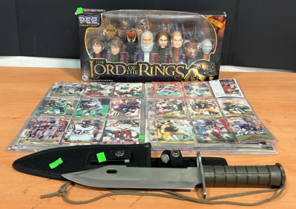 An Assortment of Football Cards (1) 2011 Lord of The Rings Collector PEZ Dispenser (1) Tactical Kinfe With Fishing Line, Compass, And More