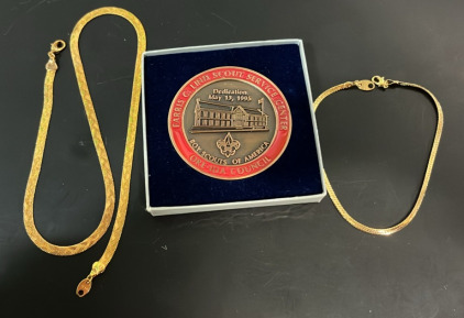 (1) Boy Scouts of America Coin (1) Avon Gold Necklace (1) Avon Gold Bracelet