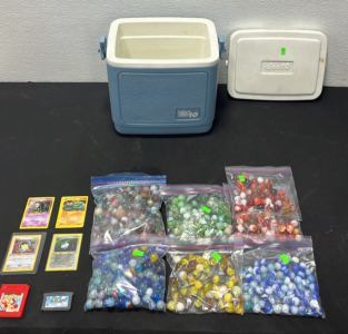 (4) Pok&eacute;mon Cards (1) Pok&eacute;mon Nintendo Gameboy Game (1) Super Mario World Gameboy Advanced Game (7) Bags of Color Coded Marbles (1) Igloo Legend 10 Cooler