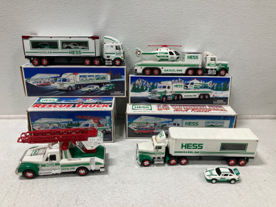 (1) 1995 Hess Toy Truck and Helicopter, (1) 1997 Hess Toy Truck and Racers, (1) Hess 1994 Rescue Truck, (1) 1992 Hess 18 Wheeler Truck & Trailer With Racer