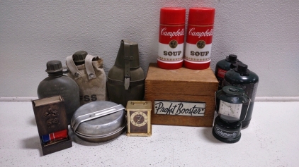 (2) "Campbell's Soup" Thermos Containers, A Coleman Green Collectable Clock Lantern, (2) Coleman Propane Tanks, Assorted Military Water Bottles, & Much More