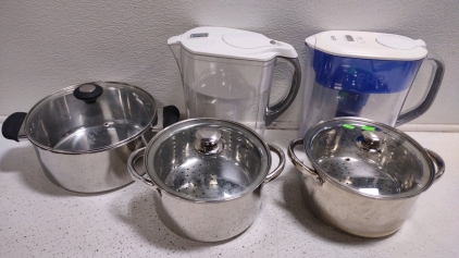 (1) Smart Living Pot w/ Vented Lid, (2) Smart Living 4qt. Stainless Steel Pots w/ Lids & Strainers, & (2) Water Purifier Pitchers