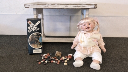 Porcelain Doll, White Bench, Clay Seashells, and .22 Rifle Cleaning Kit