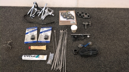 Shimano Foothold Petals, Bike Shoe Bottom Locks, Spokes, Spoke Compound, Rear Derailleur Gears, Freewheel Removers, Lube, 700c Bike Tube, and Rear Axle with Parts