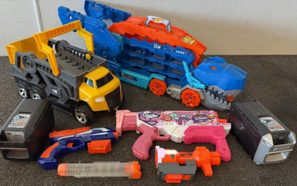 (1) Hot Wheel Dragon Hot Wheel Organizer, (1) Cat Dump Truck (3) , Nerf Guns, (2) Lithium-Ion Batteries