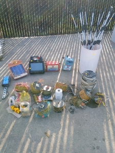 (5) Electric Fence Supplies - (5) Solar Fence Chargers (1) Bucket w/ Fence Posts (15) Spools of Fence Wire & Accessories