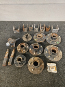 Assorted Rusted Trailer or Agricultural Axle Components, Including Hubs, Spindles, U-Bolts, and Bearings