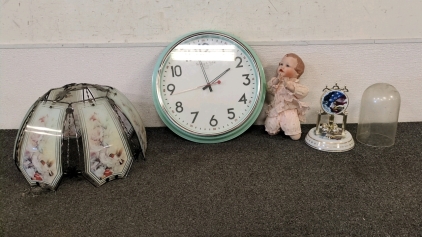 Lampshade, Porcelain Doll, and Clocks