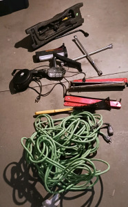 (11) Automotive Garage Tools - (1) Lug Wrench (1) Scissor Jack (1) Work Light on Reel (1) Car Vacuum (1) Extension Cord (5) Reflective Triangles (1) Ice Scraper and More