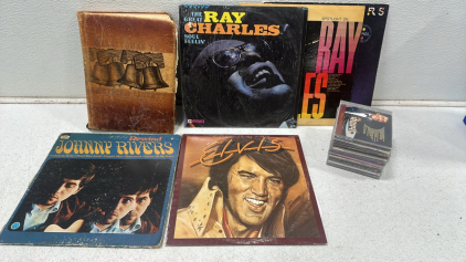 (5) Vintage Vinyl Records Including: Ray Charles, Elvis, Johnny Rivers, and Venus & Mars, Milestones to American Liberty Graphic Book, (10) Various CDs Including: Dean Martin, Disney, and More