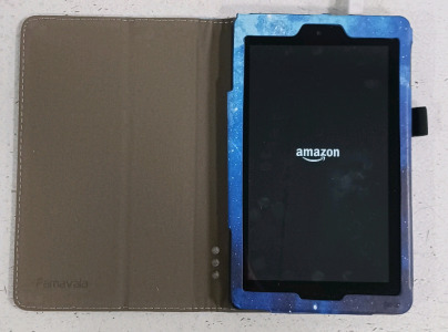 (1) Amazon Fire Tablet w/ Blue Cosmic Galaxy Case & Charger - Powers On!