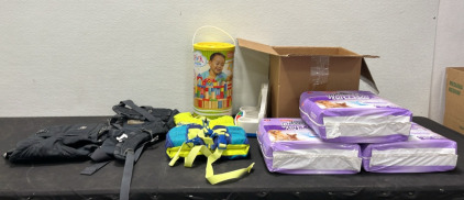 (1) Baby Carrier (1) Youth Life Jacket (1) Container of Toy Blocks (1) Box of Babt Toys (3) Bags of Dog Pads