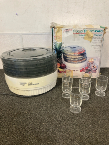 Food Dehydrator with lid cracked and 6 small glasses