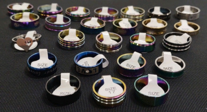 (25) Assorted Sized Rainbow Metallic/ Gold Toned Stainless Steel Assorted Style Rings