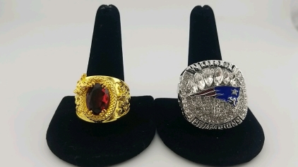 (1) Large Golden Plated Gemstone Ring - Size 13, (1) Large Silver Plated World Champions Patriots Ring - Size 12