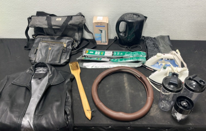(1) Guess Leather Jacket -Womens Large- (1) Sensor Soap Dispenser (2) Purses (2) Irons (1) Water Heating Pitcher (1) Steering Wheel Cover (2) Door Sweeps & More