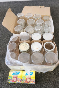 24 Canning Jars of Various Sizes, And 2 boxes of Fruit Pectin.