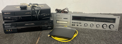 Wilshire AM/FM Stereo Clock Radio 8 Track Player, Quastar VHS Player, Sansui VHS Player
