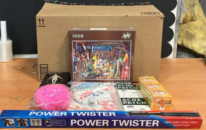 (1) Power Twister (1) 1008 Puzzle Advent Calander (1) Mini Razor Blade & An Amazon Returns Box