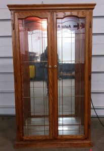 (1) Lighted Oak Curio Cabinet