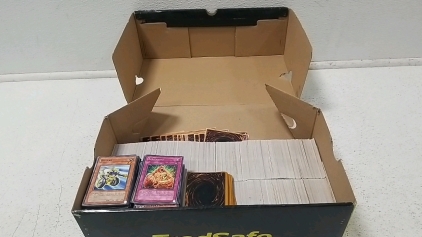 Box full of Yu-Gi-Oh! Cards