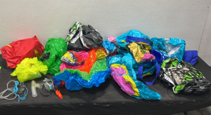 (12) Inflatable Pool Toys (3) Pairs of Goggles (1) Hammock in a Bag (1) Youth Lifejacket (1) Rifle Bag