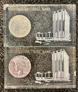 (2) Washington Trust Bank Paperweights: 1921 Morgan Silver Dollar and 1922 Peace Silver Dollar