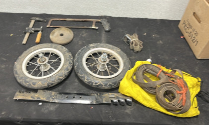(2) Bike Wheels (1) Lawn Mower Blade (1) Saw (1) Clamp (1) Vintage Belt (2) Automotive Belts