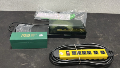 (1) Utility Power Strip (1) Coin Grading Service Container (1) Backyard Discovery Power Strip