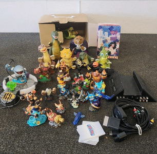 Skylanders Game And Figurines, PS2 Docking Station, Land Before Time Figurines, Beast Figurine, And Hunchback Of Notre Dome Trading Cards!